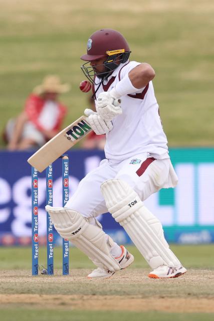 West Indies' Brandon King is hit by a bouncer during day four of the 3rd international Test cricket match between New Zealand and West Indies at Bay Oval in Mount Maunganui on December 21, 2025. (Photo by Michael Bradley / AFP)