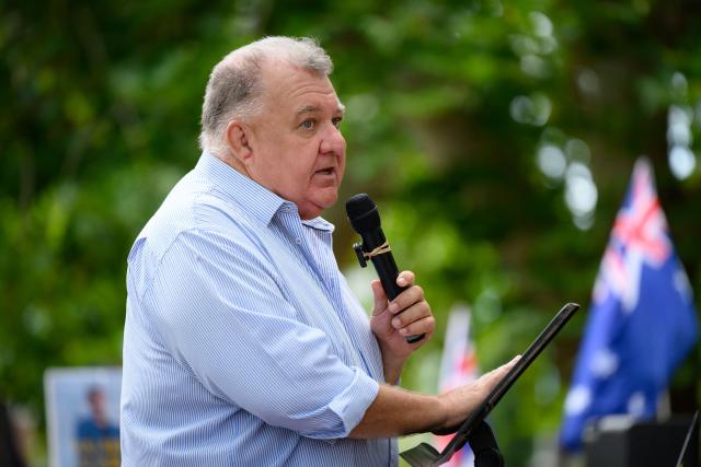 Former member of the Australian House of Representatives, Craig Kelly, speaks during the anti-immigration 'Put Australia First' rally at Prince Alfred Park in Sydney on December 21, 2025, one week after the Bondi Beach mass shooting. (Photo by GEORGE CHAN / AFP)