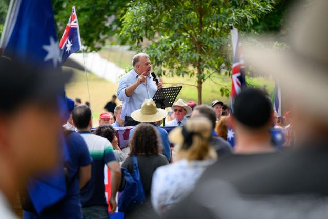 Former member of the Australian House of Representatives, Craig Kelly, speaks during the anti-immigration 'Put Australia First' rally at Prince Alfred Park in Sydney on December 21, 2025, one week after the Bondi Beach mass shooting. (Photo by GEORGE CHAN / AFP)