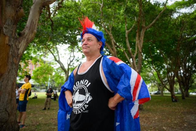 A participant looks on during the anti-immigration 'Put Australia First' rally at Prince Alfred Park in Sydney on December 21, 2025, one week after the Bondi Beach mass shooting. (Photo by GEORGE CHAN / AFP)