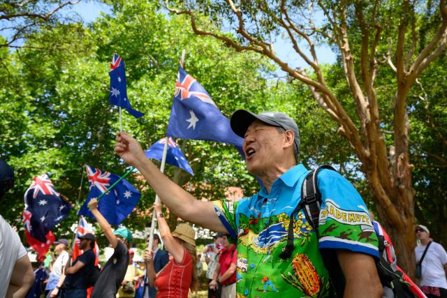 Participants attend the anti-immigration 'Put Australia First' rally at Prince Alfred Park in Sydney on December 21, 2025, one week after the Bondi Beach mass shooting. (Photo by GEORGE CHAN / AFP)
