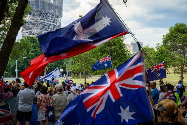 Participants attend the anti-immigration 'Put Australia First' rally at Prince Alfred Park in Sydney on December 21, 2025, one week after the Bondi Beach mass shooting. (Photo by GEORGE CHAN / AFP)