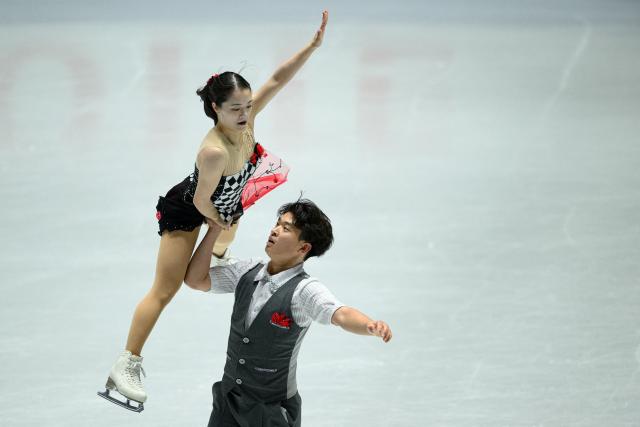 Japan's Ayumi Kagotani and Lucas Tsuyoshi Honda compete in the pairs free skating during Japan Figure Skating Championships in Tokyo on December 21, 2025. (Photo by Philip FONG / AFP)