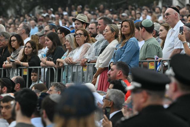 Mourners attend the memorial held for the victims of a shooting at Bondi Beach in Sydney on December 21, 2025. A father and his son are accused of spraying bullets into the family-thronged Hanukkah celebration at Sydney's most famous beach on December 14, allegedly inspired by "Islamic State ideology". (Photo by Saeed KHAN / AFP)
