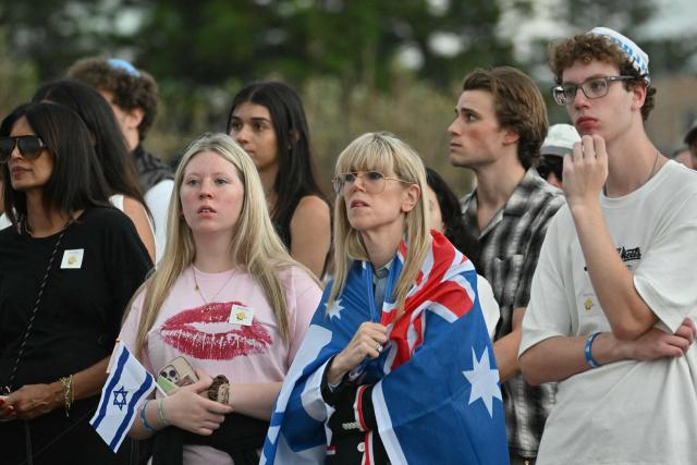 Mourners attend the memorial held for the victims of a shooting at Bondi Beach in Sydney on December 21, 2025. A father and his son are accused of spraying bullets into the family-thronged Hanukkah celebration at Sydney's most famous beach on December 14, allegedly inspired by "Islamic State ideology". (Photo by Saeed KHAN / AFP)