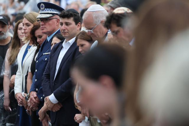 Mourners attend the memorial held for the victims of a shooting at Bondi Beach in Sydney on December 21, 2025. A father and his son are accused of spraying bullets into the family-thronged Hanukkah celebration at Sydney's most famous beach on December 14, allegedly inspired by "Islamic State ideology". (Photo by DAVID GRAY / AFP)