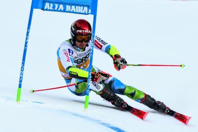 Slovenia's Zan Kranjec competes in the first run of the Men's Giant Slalom event, part of the FIS Alpine Ski World Cup 2025-2026, in Alta Badia, northern Italy, on December 21, 2025. (Photo by Stefano RELLANDINI / AFP)