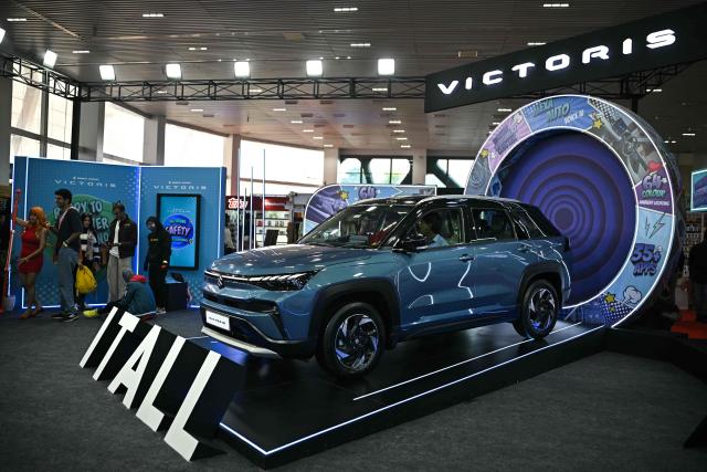 A model of automaker Maruti Suzuki’s Victoris is displayed during the Bengaluru Comic Con 2025 fest in Bengaluru on December 21, 2025. (Photo by Idrees MOHAMMED / AFP)