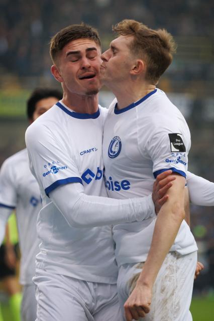 Gent's Maksim Paskotsi (R) celebrates after scoring a goal during the Belgian Pro League football match between Club Brugge and KAA Gent, in Bruges, on December 21, 2025. (Photo by KURT DESPLENTER / Belga / AFP) / Belgium OUT