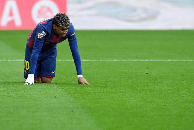 Barcelona's Spanish forward #10 Lamine Yamal reacts during the Spanish league football match between Villarreal CF and FC Barcelona at La Ceramica Stadium in Vila-real on December 21, 2025. (Photo by JOSE JORDAN / AFP)