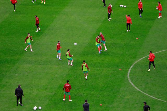 Morocco's players warm up prior the Africa Cup of Nations (CAN) group A  football match between Morocco and Comoros at Prince Moulay Abdellah Stadium in Rabat on December 21, 2025. (Photo by Abdel Majid BZIOUAT / AFP)