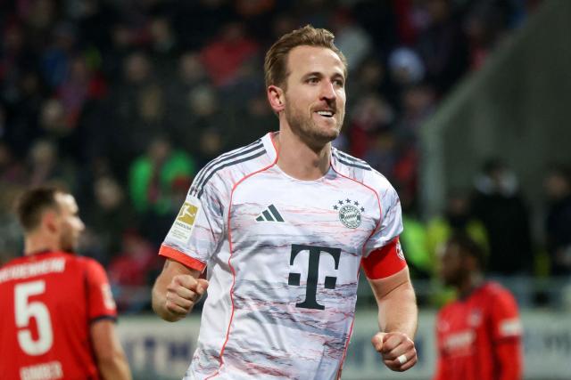 Bayern Munich's English forward #09 Harry Kane celebrates scoring his team's fourth goal during the German first division Bundesliga football match between  FC Heidenheim and FC Bayern Munich in Heidenheim, southern Germany, on December 21, 2025. Bayern Munich won the match 4-0. (Photo by Karl-Josef HILDENBRAND / AFP) / DFL REGULATIONS PROHIBIT ANY USE OF PHOTOGRAPHS AS IMAGE SEQUENCES AND/OR QUASI-VIDEO