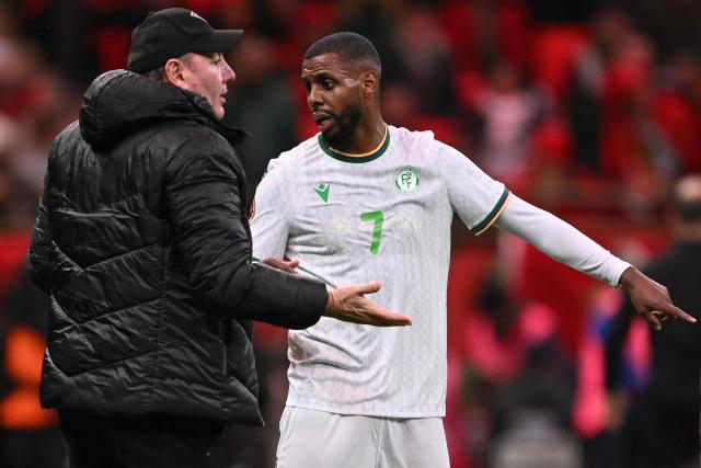 Comoros' head coach Stefano Cusin speaks to Comoros's forward #07 Faiz Selemani during the Africa Cup of Nations (CAN) group A  football match between Morocco and Comoros at Prince Moulay Abdellah Stadium in Rabat on December 21, 2025. (Photo by SEBASTIEN BOZON / AFP)