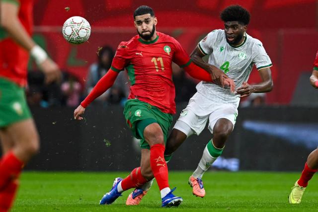 Morocco's midfielder #11 Ismael Saibari and Comoros's defender #04 Kenan Toibibou (R) vie during the Africa Cup of Nations (CAN) group A  football match between Morocco and Comoros at Prince Moulay Abdellah Stadium in Rabat on December 21, 2025. (Photo by Paul ELLIS / AFP)
