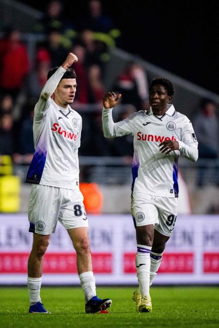 RSC Anderlecht's Belgian forward #83 Tristan Degreef celebrates with teammates after scoring his team second goal during the Belgian "Pro League" First Division football match between Antwerp and RSC Anderlecht at Bosuilstadion in Antwerp on December 21, 2025. (Photo by JASPER JACOBS / BELGA / AFP) / Belgium OUT