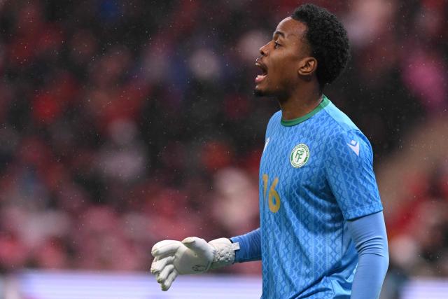 Comoros's goalkeeper #16 Yannick Pandor reacts during the Africa Cup of Nations (CAN) group A  football match between Morocco and Comoros at Prince Moulay Abdellah Stadium in Rabat on December 21, 2025. (Photo by SEBASTIEN BOZON / AFP)