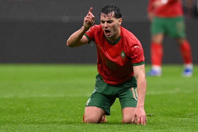 Morocco's forward #10 Brahim Diaz reacts during the Africa Cup of Nations (CAN) group A  football match between Morocco and Comoros at Prince Moulay Abdellah Stadium in Rabat on December 21, 2025. (Photo by SEBASTIEN BOZON / AFP)