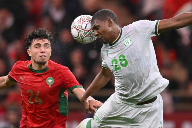 Morocco's midfielder #24 Neil El Aynaoui fights for the ball with Comoros's midfielder #28 Zaydou Youssouf during the Africa Cup of Nations (CAN) group A  football match between Morocco and Comoros at Prince Moulay Abdellah Stadium in Rabat on December 21, 2025. (Photo by SEBASTIEN BOZON / AFP)