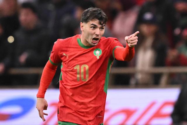 Guest and Morocco's forward #10 Brahim Diaz celebrates scoring his team's first goal during the Africa Cup of Nations (CAN) group A  football match between Morocco and Comoros at Prince Moulay Abdellah Stadium in Rabat on December 21, 2025. (Photo by SEBASTIEN BOZON / AFP)
