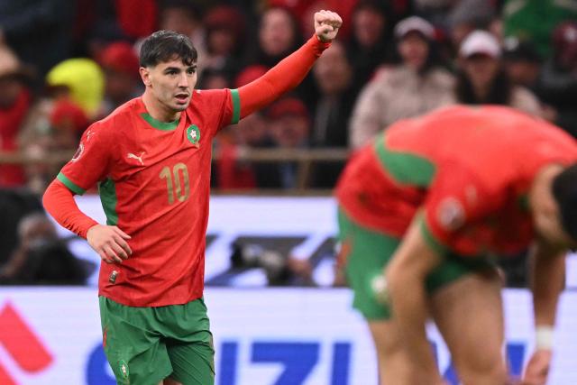 Guest and Morocco's forward #10 Brahim Diaz celebrates scoring his team's first goal during the Africa Cup of Nations (CAN) group A  football match between Morocco and Comoros at Prince Moulay Abdellah Stadium in Rabat on December 21, 2025. (Photo by SEBASTIEN BOZON / AFP)