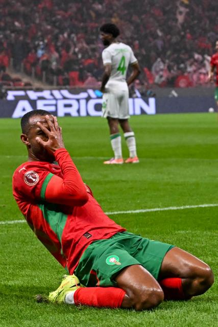 Morocco's forward #20 Ayoub El Kaabi calebrates his goal during the Africa Cup of Nations (CAN) group A  football match between Morocco and Comoros at Prince Moulay Abdellah Stadium in Rabat on December 21, 2025. (Photo by Paul ELLIS / AFP)