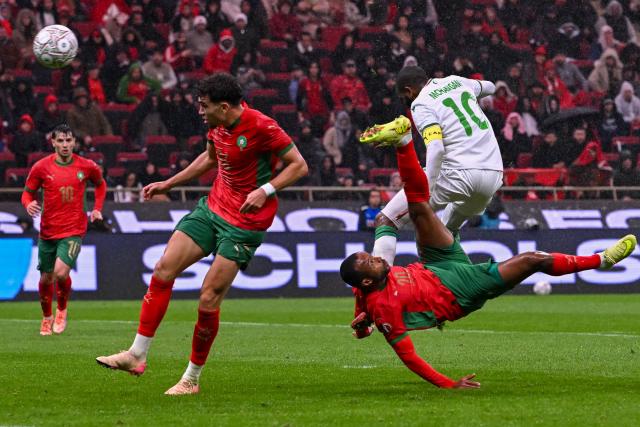 Morocco's forward #20 Ayoub El Kaabi scores a goal during the Africa Cup of Nations (CAN) group A  football match between Morocco and Comoros at Prince Moulay Abdellah Stadium in Rabat on December 21, 2025. (Photo by Paul ELLIS / AFP)