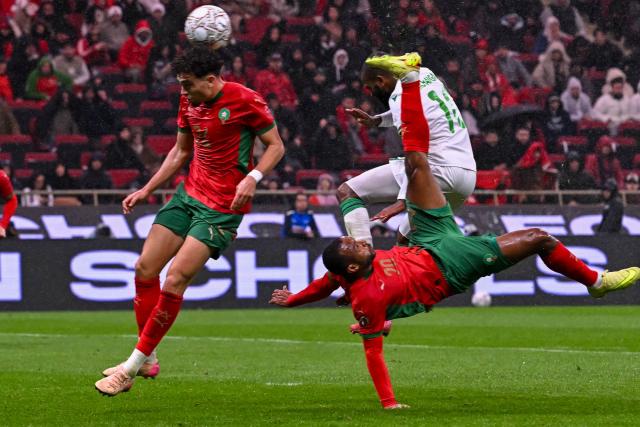 Morocco's forward #20 Ayoub El Kaabi scores a goal during the Africa Cup of Nations (CAN) group A  football match between Morocco and Comoros at Prince Moulay Abdellah Stadium in Rabat on December 21, 2025. (Photo by Paul ELLIS / AFP)
