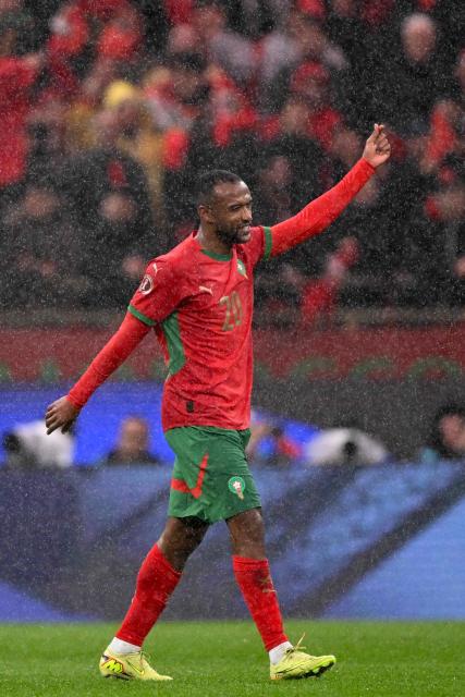Morocco's forward #20 Ayoub El Kaabi celebrates after scoring his team's second goal during the Africa Cup of Nations (CAN) group A football match between Morocco and Comoros at Prince Moulay Abdellah Stadium in Rabat on December 21, 2025. (Photo by SEBASTIEN BOZON / AFP)