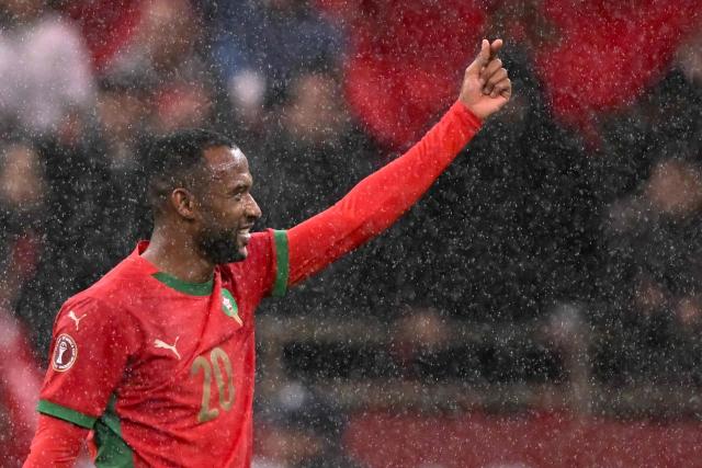 Morocco's forward #20 Ayoub El Kaabi celebrates after scoring his team's second goal during the Africa Cup of Nations (CAN) group A football match between Morocco and Comoros at Prince Moulay Abdellah Stadium in Rabat on December 21, 2025. (Photo by SEBASTIEN BOZON / AFP)