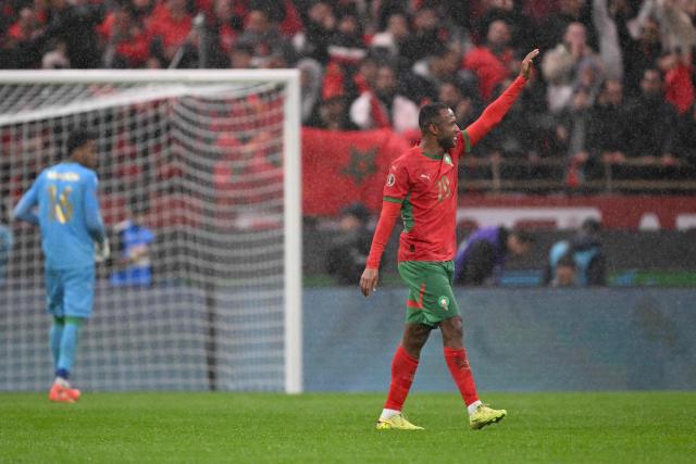 Morocco's forward #20 Ayoub El Kaabi celebrates after scoring his team's second goal during the Africa Cup of Nations (CAN) group A football match between Morocco and Comoros at Prince Moulay Abdellah Stadium in Rabat on December 21, 2025. (Photo by SEBASTIEN BOZON / AFP)