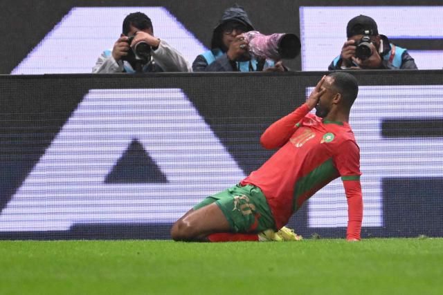 Morocco's forward #20 Ayoub El Kaabi celebrates scoring his team's second goal during the Africa Cup of Nations (CAN) group A  football match between Morocco and Comoros at Prince Moulay Abdellah Stadium in Rabat on December 21, 2025. (Photo by SEBASTIEN BOZON / AFP)