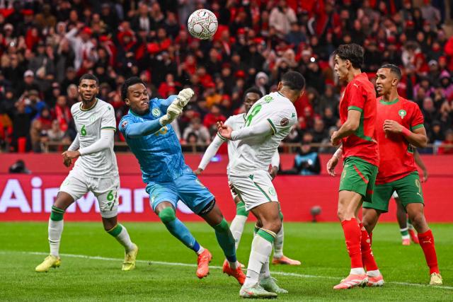 Comoros's goalkeeper #16 Yannick Pandor makes a save during the Africa Cup of Nations (CAN) group A  football match between Morocco and Comoros at Prince Moulay Abdellah Stadium in Rabat on December 21, 2025. (Photo by Paul ELLIS / AFP)