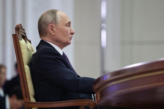 In this pool photograph distributed by Russian state agency Sputnik, Russia's President Vladimir Putin attends the informal summit of Commonwealth of Independent States (CIS) leaders in Saint Petersburg on December 21, 2025. (Photo by Alexander KAZAKOV / POOL / AFP)