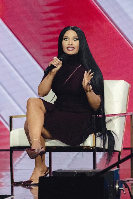 US rapper Nicki Minaj speaks on stage during Turning Point's annual AmericaFest conference in Phoenix, Arizona on December 21, 2025. This year’s conference commemorates the late right-wing activist Charlie Kirk, who was fatally shot on a Utah college campus in September, sparking an outpouring of grief among conservatives and prompting President Donald Trump to threaten a crackdown on the "radical left." (Photo by Olivier Touron / AFP)