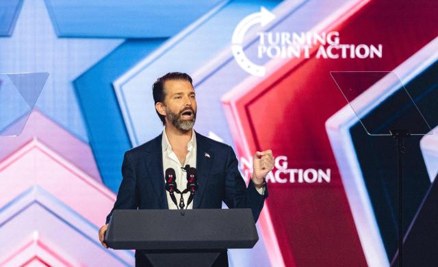 Donald Trump Jr. speaks on stage during Turning Point's annual AmericaFest conference in Phoenix, Arizona on December 21, 2025. This year’s conference commemorates the late right-wing activist Charlie Kirk, who was fatally shot on a Utah college campus in September, sparking an outpouring of grief among conservatives and prompting President Donald Trump to threaten a crackdown on the "radical left." (Photo by Olivier Touron / AFP)