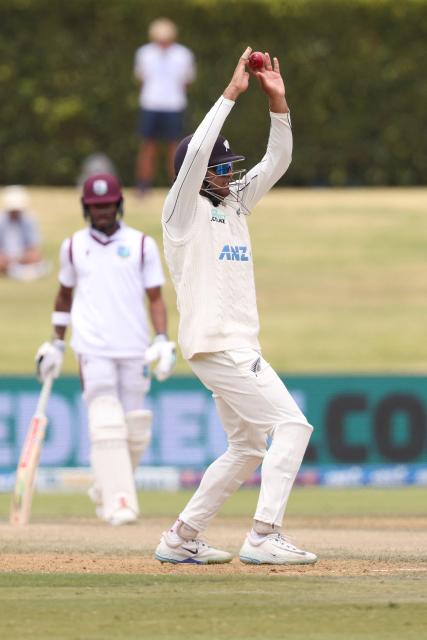 New Zealand’s Rachin Ravindra fields in close to the batter during day five of the 3rd international Test cricket match between New Zealand and West Indies at Bay Oval in Mount Maunganui, Tauranga, New Zealand on December 22, 2025. (Photo by Michael Bradley / AFP)