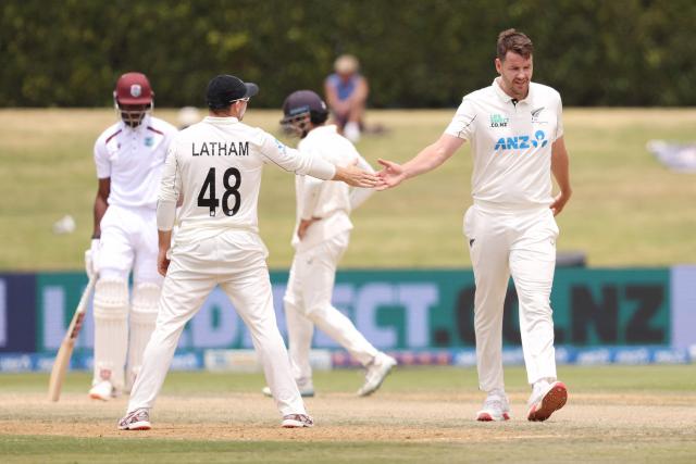 New Zealand’s Jacob Duffy (R) and Tom Latham (L) react during day five of the 3rd international Test cricket match between New Zealand and West Indies at Bay Oval in Mount Maunganui, Tauranga, New Zealand on December 22, 2025. (Photo by Michael Bradley / AFP)