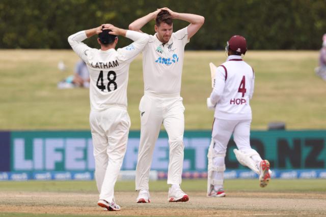 New Zealand’s Jacob Duffy (R) and Tom Latham (L) react during day five of the 3rd international Test cricket match between New Zealand and West Indies at Bay Oval in Mount Maunganui, Tauranga, New Zealand on December 22, 2025. (Photo by Michael Bradley / AFP)
