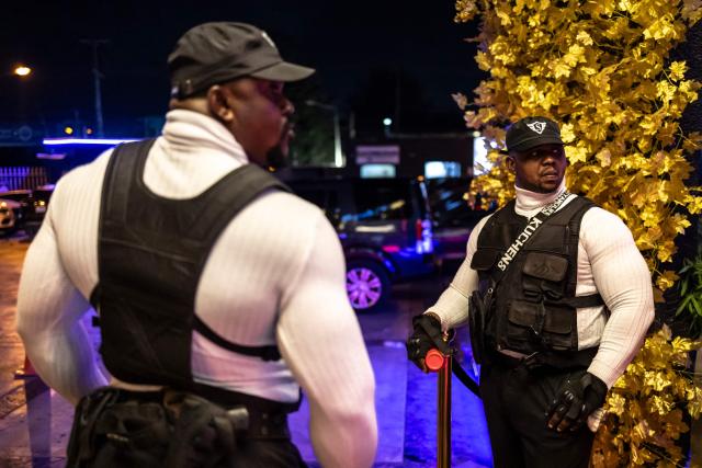 Bouncers stand at the entrance of the Voyage nightclub during “Detty December” in Ikeja, Lagos, on December 7, 2025. “Detty December” refers to the lively Lagos tradition where December is packed with nonstop parties, concerts, nightlife, and cultural events, fuelled by returning diaspora Nigerians and heightened local celebration. The city becomes especially vibrant and crowded as entertainment and tourism peak. The spelling “detty” comes from Nigerian Pidgin English, where it is a playful version of “dirty” that implies excess, intensity, and carefree fun. (Photo by OLYMPIA DE MAISMONT / AFP)