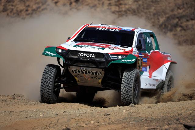 (FILES) Argentinia's driver Juan Cruz Yacopini and co driver Daniel Oliveras during the prologue of the 47th Dakar Rally, in Bisha, Saudi Arabia, on January 3, 2025. Argentine driver Juan Cruz Yacopini is hospitalized after a serious accident during his vacation in the Argentine province of Mendoza and will not participate in the 2026 Dakar Rally, his team reported on December 21, 2025. (Photo by Valery HACHE / AFP)
