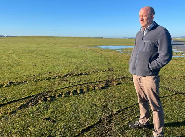 Cathal Berry, a former Irish army special forces member, stands on The Curragh plain, the location set for Ireland's largest military base, west of Dublin, on December 19, 2025. (Photo by Peter MURPHY / AFP) / TO GO WITH AFP STORY by Peter MURPHY