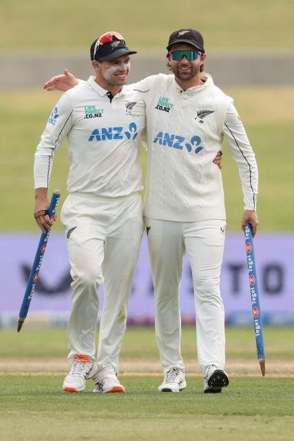 New Zealand’s Tom Latham (L) and Devon Conway leave the field at the end of play on day five of the 3rd international Test cricket match between New Zealand and West Indies at Bay Oval in Mount Maunganui, Tauranga, New Zealand on December 22, 2025. (Photo by Michael Bradley / AFP)