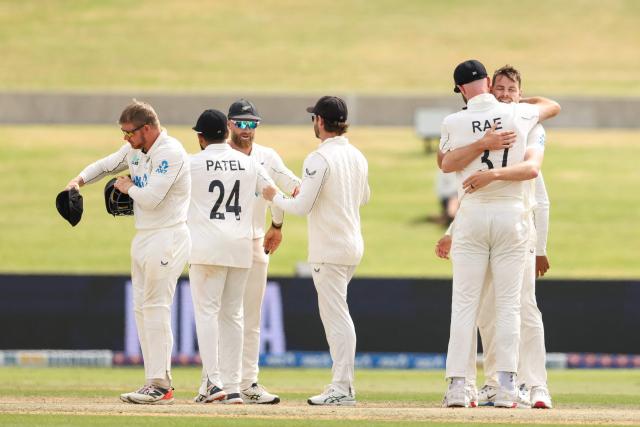 New Zealand’s Jacob Duffy and Michael Rae celebrate victory after day five of the 3rd international Test cricket match between New Zealand and West Indies at Bay Oval in Mount Maunganui, Tauranga, New Zealand on December 22, 2025. (Photo by Michael Bradley / AFP)