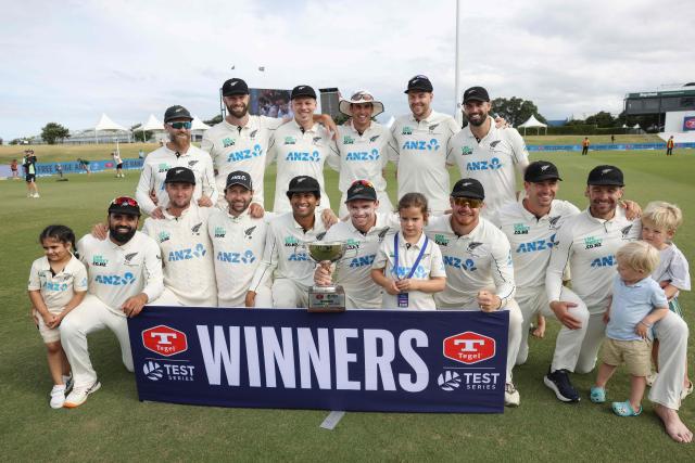 New Zealand players celebrate the series victory after day five of the 3rd international Test cricket match between New Zealand and West Indies at Bay Oval in Mount Maunganui, Tauranga, New Zealand on December 22, 2025. (Photo by Michael Bradley / AFP)