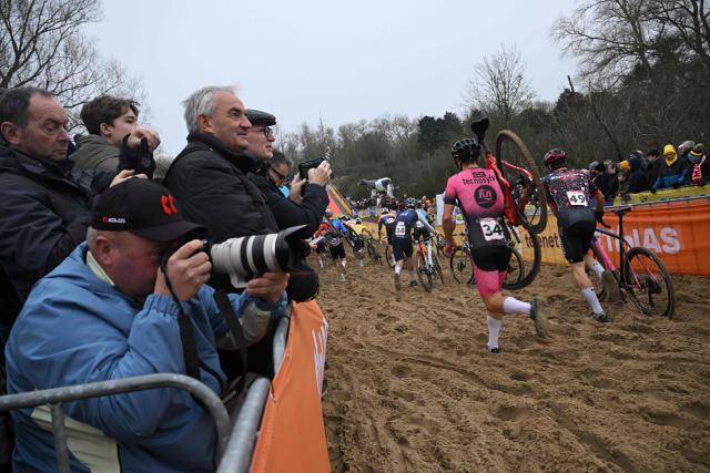 Fans cheer during the men's elite race of the cyclo-cross World Cup, stage 6 out of 12 of the UCI World Cup competition, in Koksijde on December 21, 2025. (Photo by Nicolas TUCAT / AFP)
