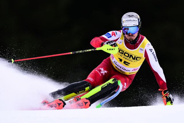 Austria's Manuel Feller competes in the first run of the Men's Slalom event, part of the FIS Alpine Ski World Cup 2025-2026, in Alta Badia, northern Italy, on December 22, 2025. (Photo by Stefano RELLANDINI / AFP)