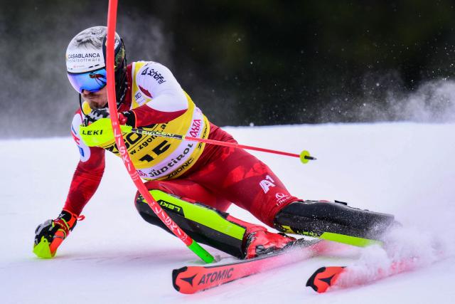 Austria's Manuel Feller competes in the first run of the Men's Slalom event, part of the FIS Alpine Ski World Cup 2025-2026, in Alta Badia, northern Italy, on December 22, 2025. (Photo by Stefano RELLANDINI / AFP)