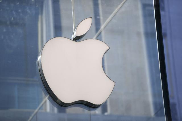 (FILES) A picture taken in center Milan on May 30, 2019 shows the logo of American multinational company Apple. Italy’s competition authority (AGCM) announced on December 22, 2025 that it had imposed a fine of more than Ђ98.6 million on the American company Apple for "abuse of dominant position". (Photo by Miguel MEDINA / AFP)