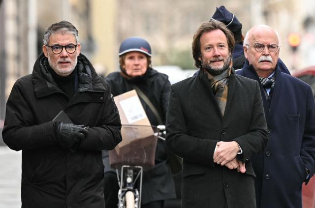 First secretary of French left-wing party Socialist (PS) Olivier Faure (L) and President of Socialistes et Apparentes parliamentary group Boris Vallaud arrive for a meeting with France's Prime Minister at the Hotel Matignon in Paris on December 22, 2025, before a cabinet meeting at the end of the day to urgently present a "special bill" aimed at breaking the budget deadlock, following the failure of the parliamentary review of the state budget. A joint committee of French lawmakers on December 19, 2025 failed to reach a compromise on the state budget for next year, parliamentary sources said, meaning France would not have a 2026 budget by year end. The 2025 budget is now likely to be carried over into the new year as debates continue in both chambers. (Photo by Bertrand GUAY / AFP)