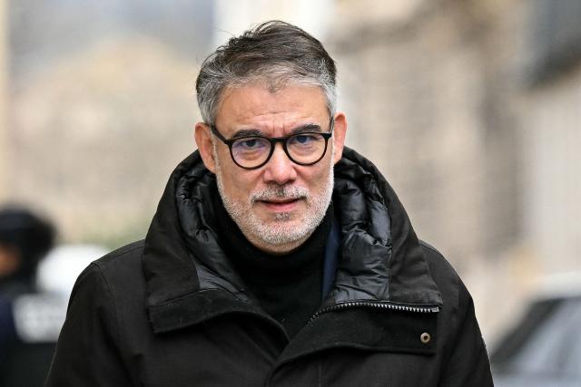 First secretary of French left-wing party Socialist (PS) Olivier Faure looks on as he arrives for a meeting with France's Prime Minister at the Hotel Matignon in Paris on December 22, 2025, before a cabinet meeting at the end of the day to urgently present a "special bill" aimed at breaking the budget deadlock, following the failure of the parliamentary review of the state budget. A joint committee of French lawmakers on December 19, 2025 failed to reach a compromise on the state budget for next year, parliamentary sources said, meaning France would not have a 2026 budget by year end. The 2025 budget is now likely to be carried over into the new year as debates continue in both chambers. (Photo by Bertrand GUAY / AFP)